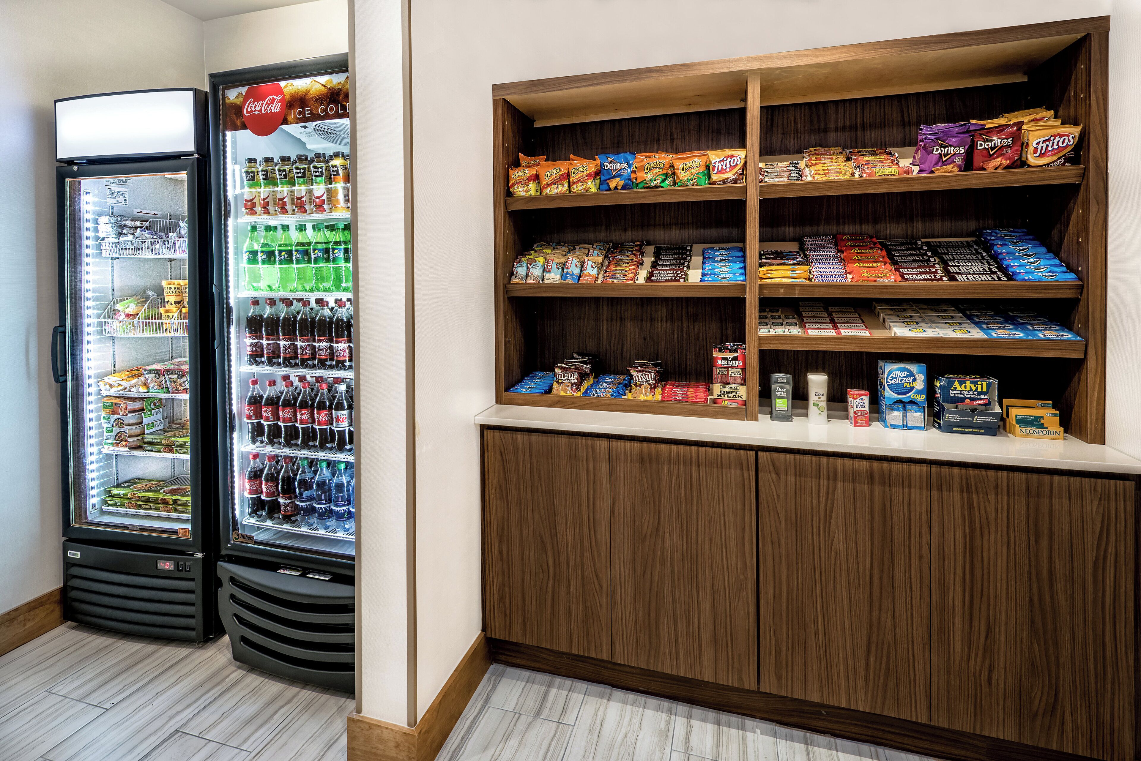 A vending machine and a snack display in a public area.