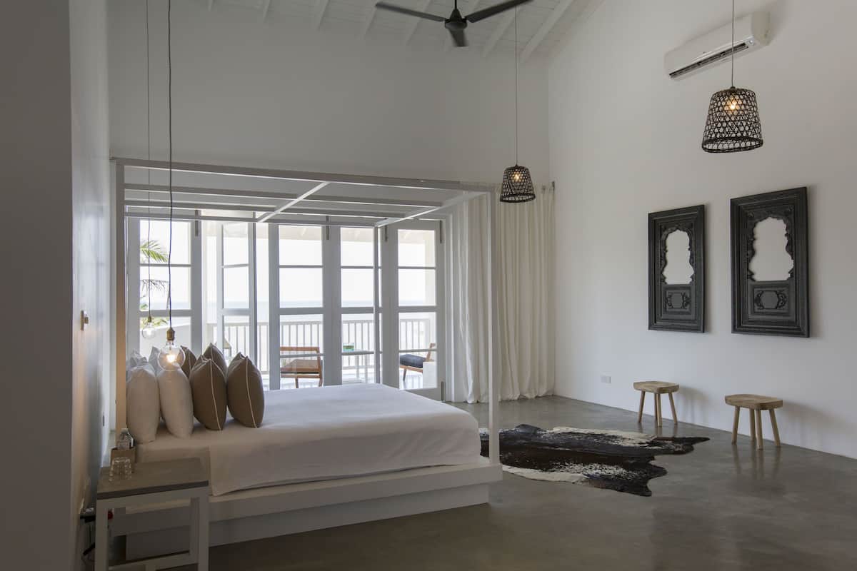 king suite with balcony & sea view | living room | flat-screen tv