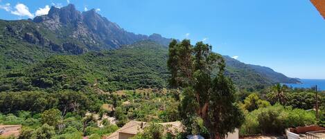 A mountainous landscape with a clear sky.