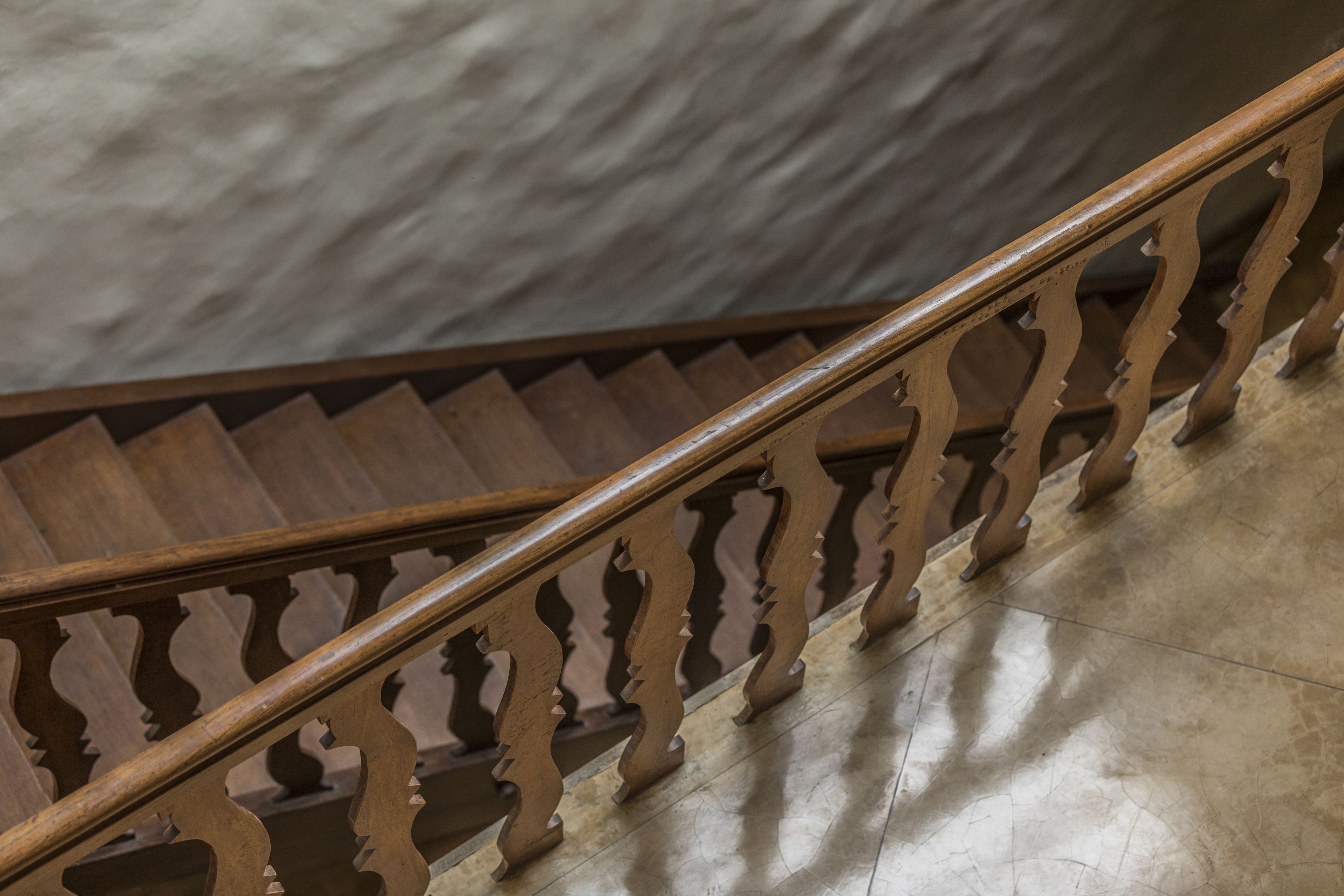 A wooden staircase with a balustrade.