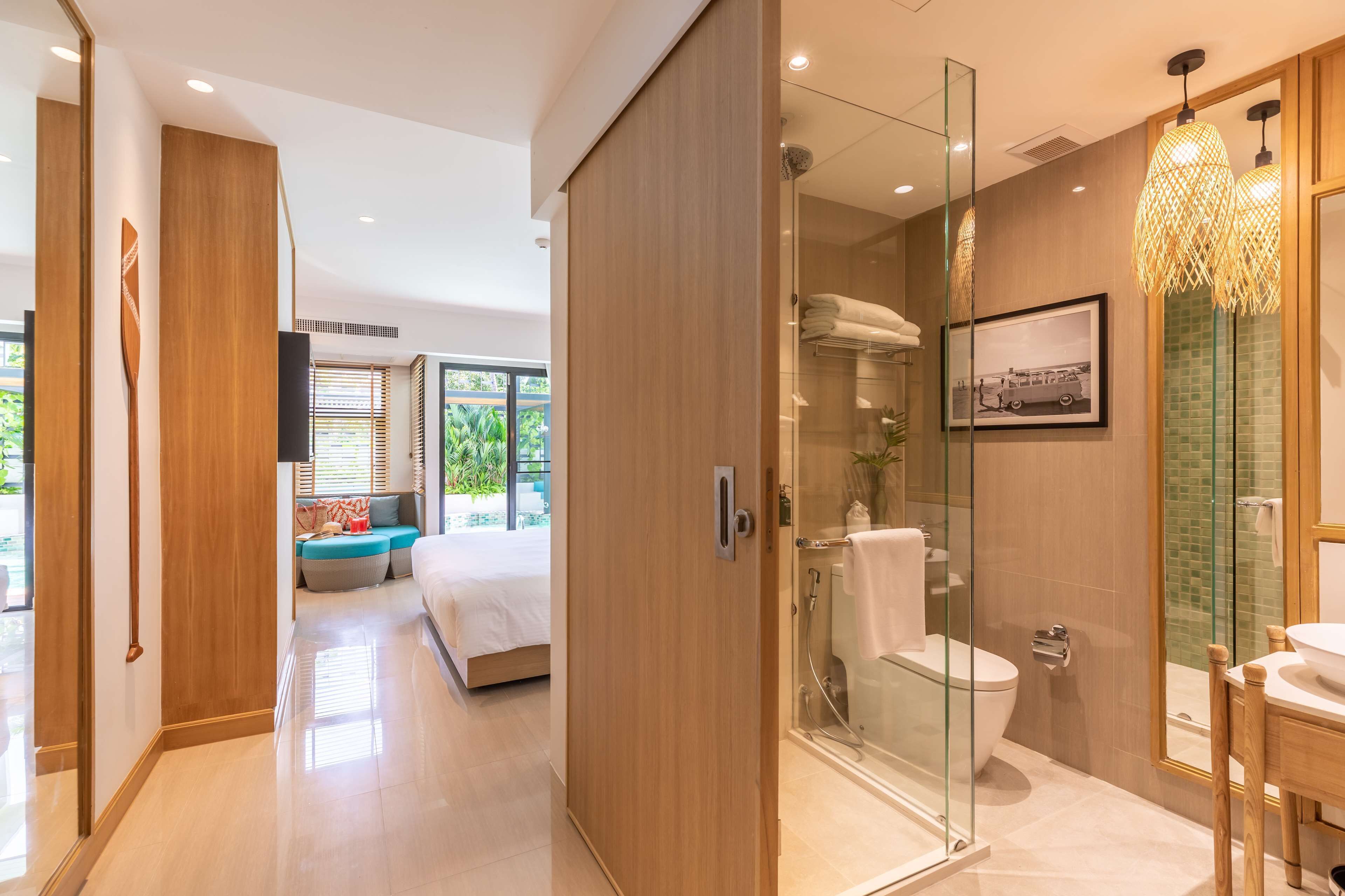 deluxe room, 1 king bed, pool access | bathroom | hair dryer, bathrobes, slippers, towels