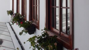 A building with large windows and wooden beams.