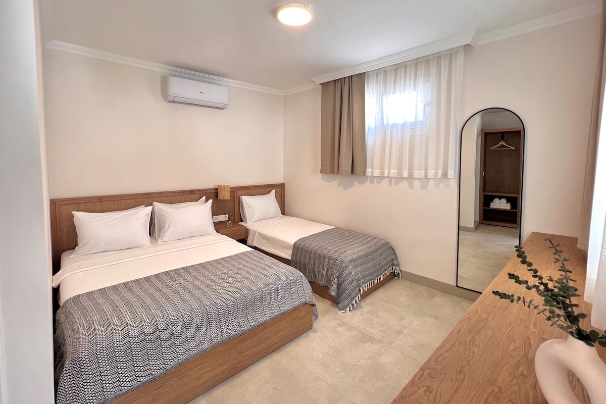Standard Triple Room, Multiple Beds, Courtyard View | In-room safe, free WiFi, bed sheets