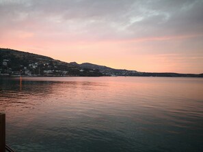 A calm lake with a town on the opposite shore. - Lavinya Otel (Bodrum)
