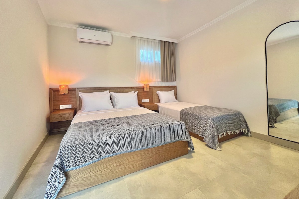 Standard Triple Room, Multiple Beds, Patio, Garden Area | In-room safe, free WiFi, bed sheets