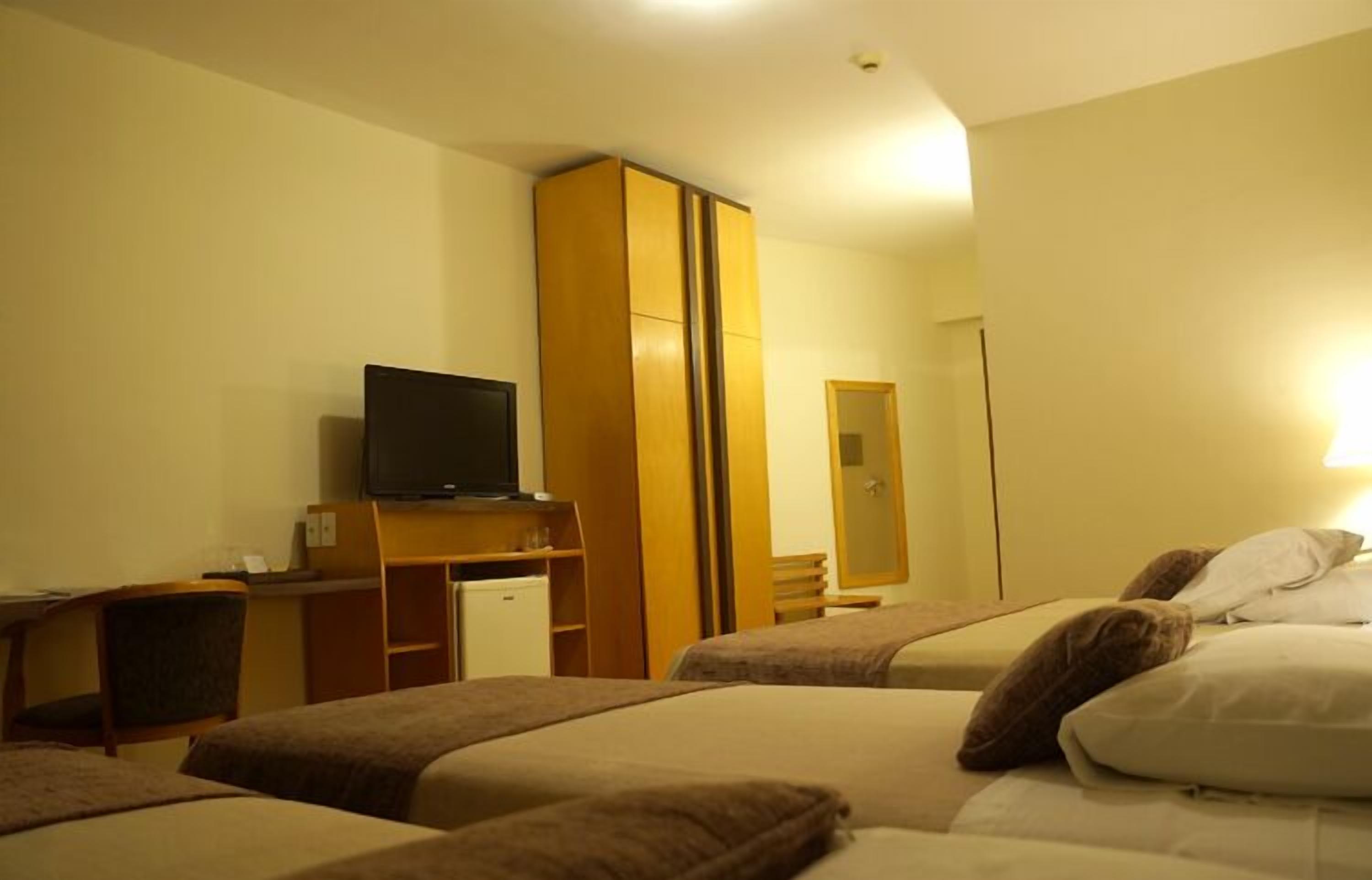 luxury quadruple room | minibar, in-room safe, desk, blackout curtains