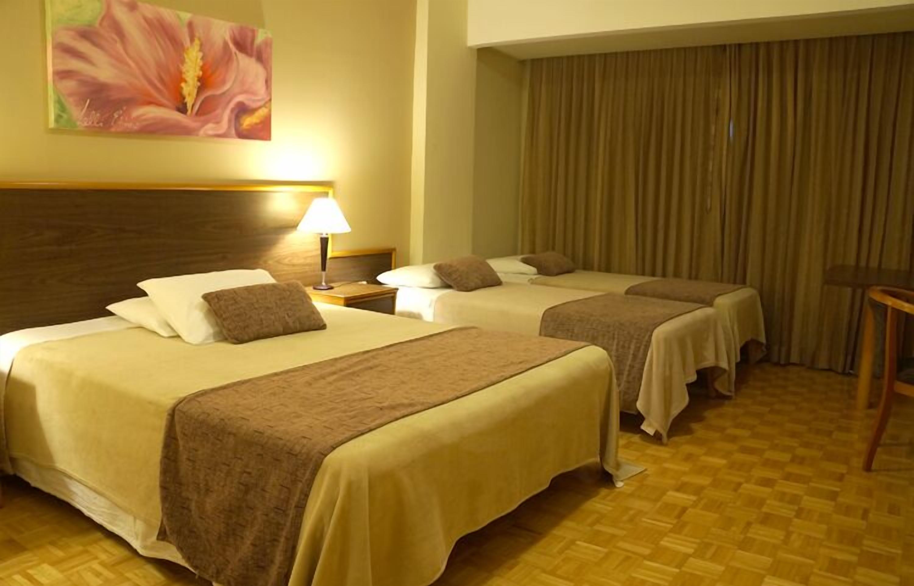 luxury quadruple room | minibar, in-room safe, desk, blackout curtains