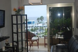 One Bedroom Apartment, Ocean View | Living room | Flat-screen TV - E&J Beach Condos (Sosúa)