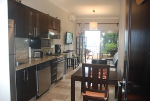 One Bedroom Apartment, Ocean View | Private kitchen | Full-size fridge, microwave, stovetop, dishwasher - E&J Beach Condos (Sosúa)