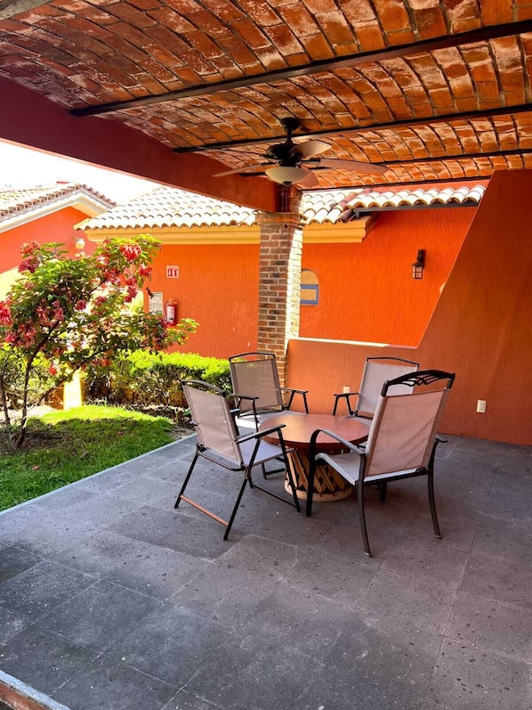 Deluxe Apartment, 2 Bedrooms | Living area | 32-inch TV with cable channels, pay movies