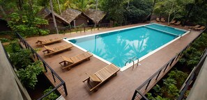 2 outdoor pools, open 7:00 AM to 8:00 PM, pool umbrellas