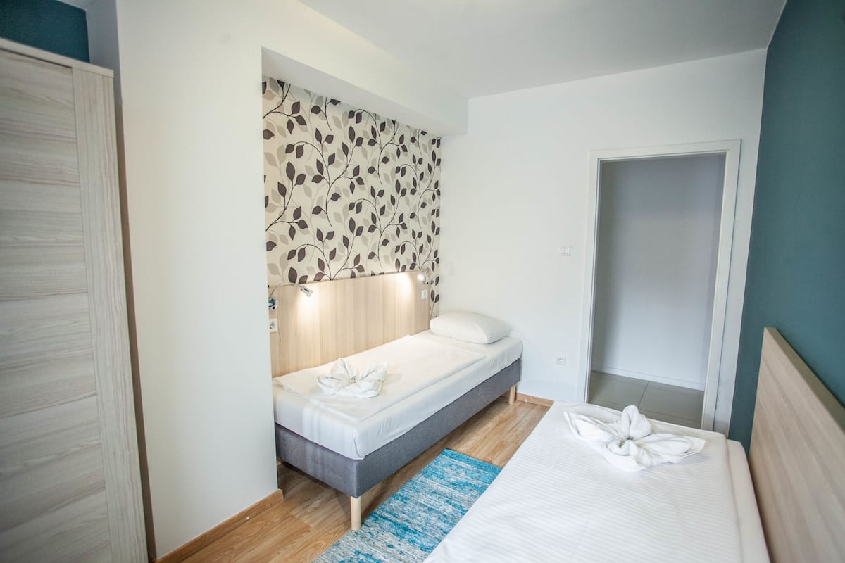 Apartment, 2 Bedrooms | 1 bedroom, blackout curtains, iron/ironing board, free WiFi