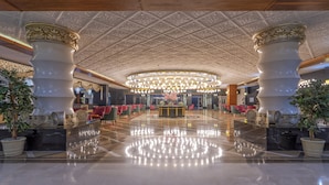 A spacious lobby with a polished marble floor, ornate ceiling, and a central chandelier. - Lake River Side Hotel Spa - Ultra All Inclusive (Manavgat)