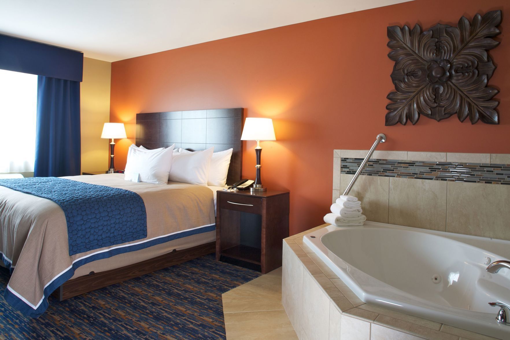 Hypo-allergenic bedding, desk, laptop workspace, blackout drapes