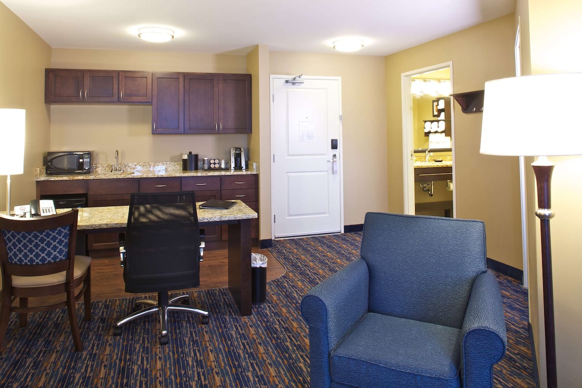 hypo-allergenic bedding, desk, laptop workspace, blackout curtains