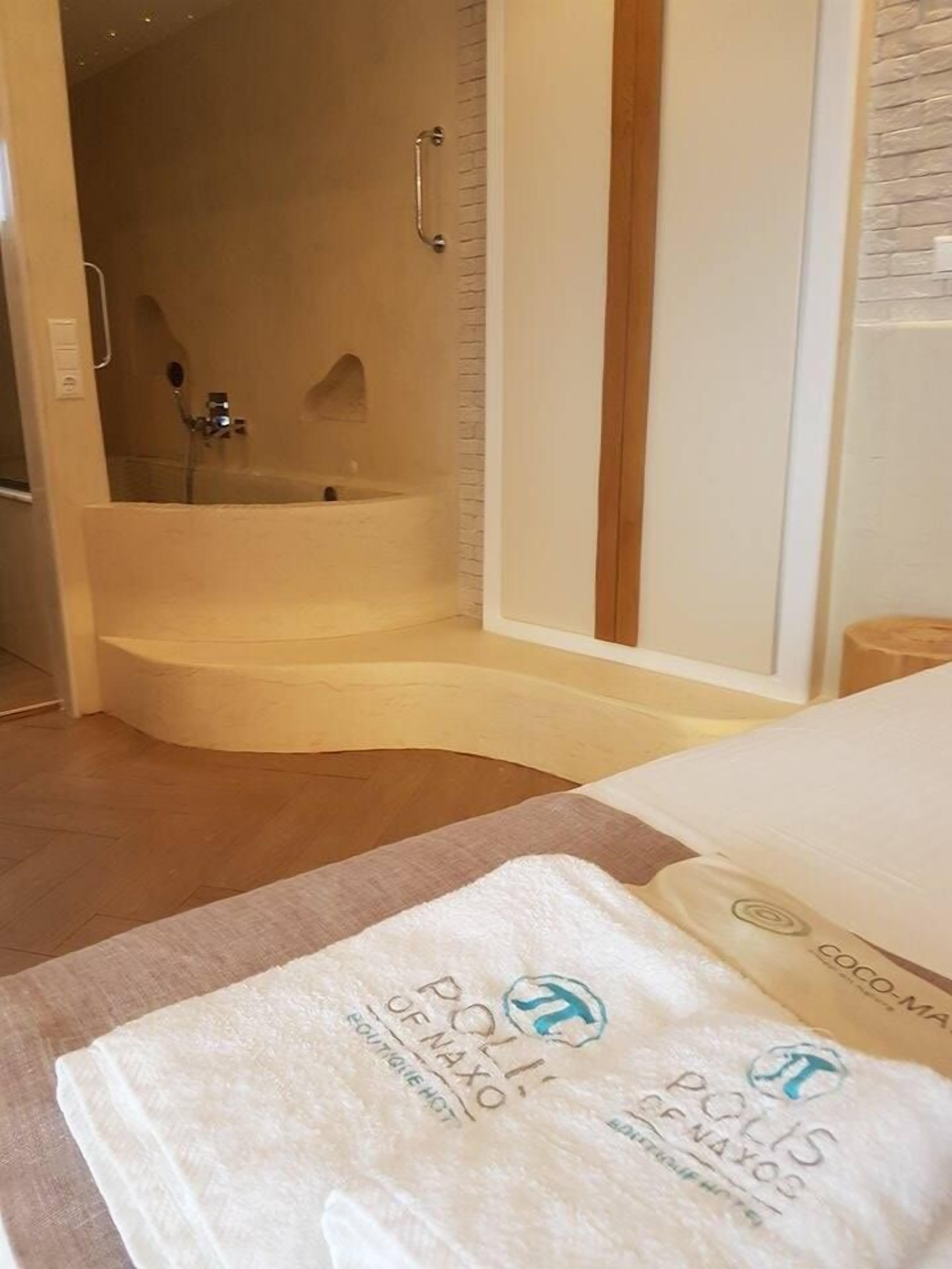 exclusive suite, jetted tub | living area | led tv