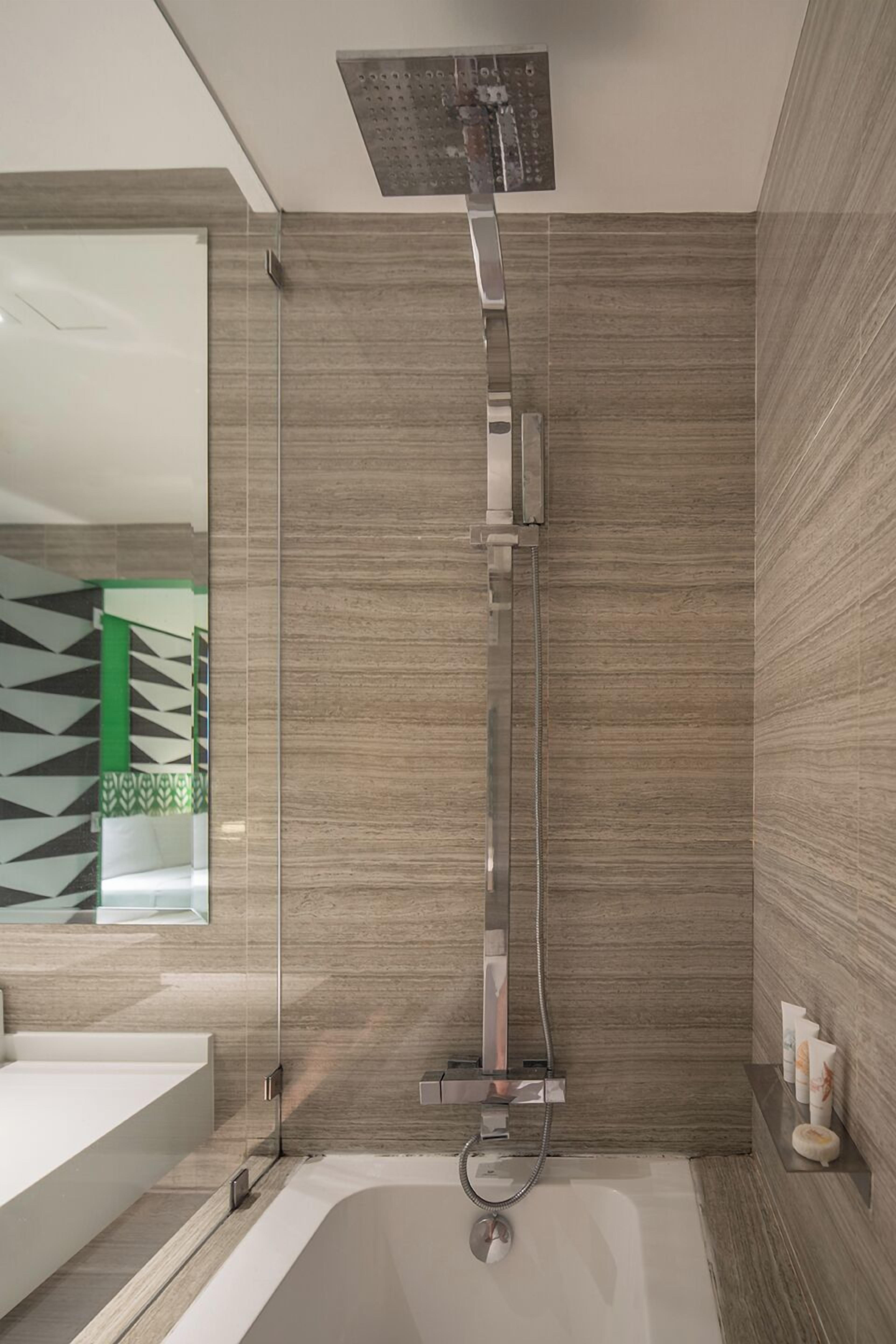 superior deluxe room | bathroom | shower, free toiletries, hair dryer, bathrobes