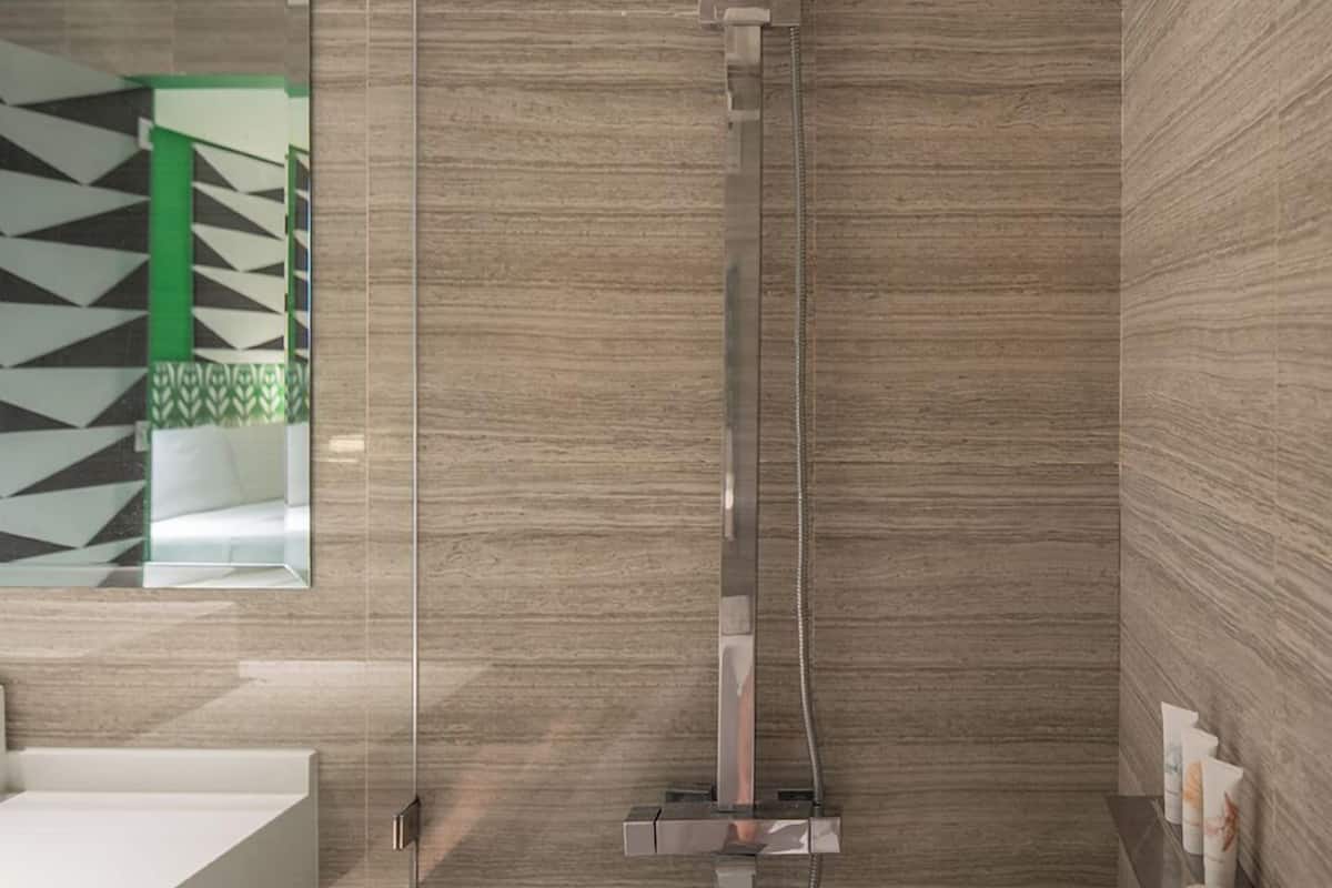 superior deluxe room | bathroom | shower, free toiletries, hair dryer, bathrobes