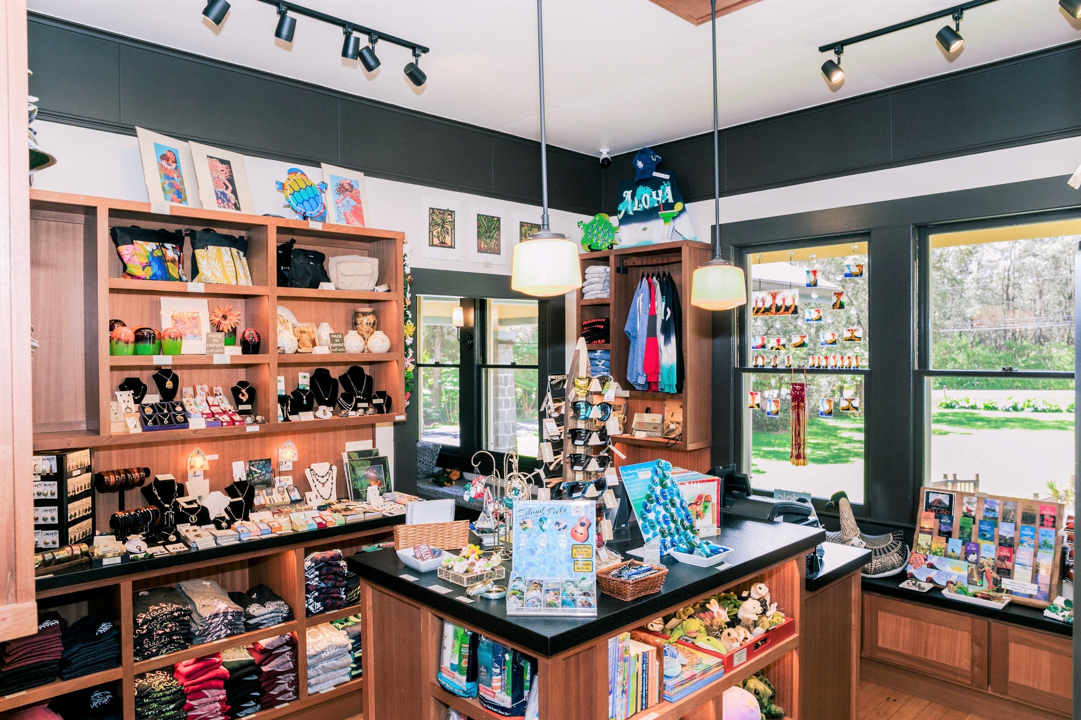 A jewelry store with shelves of necklaces, bracelets, and rings. There are also display cases with jewelry and a counter with various items.