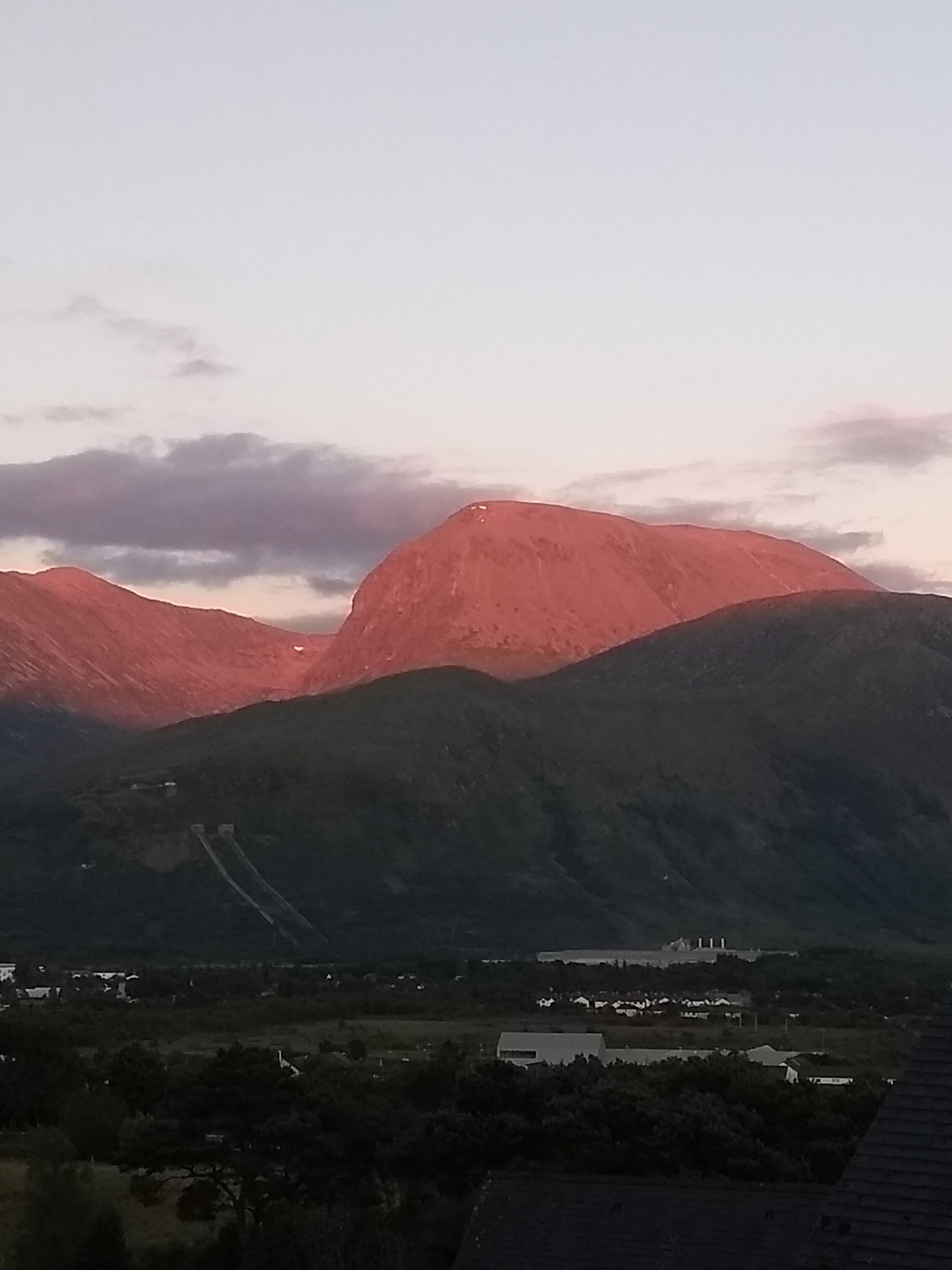 A mountain landscape with a clear sky.