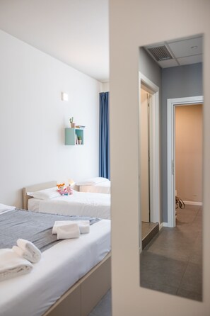 Chambre Quadruple, non-fumeurs | Coffres-forts dans les chambres, décoration personnalisée