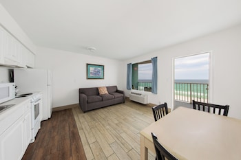 Deluxe Suite, 2 Double Beds, Kitchen, Beachfront | Living area | TV at Holiday Terrace Beachfront Hotel, a By The Sea Resort