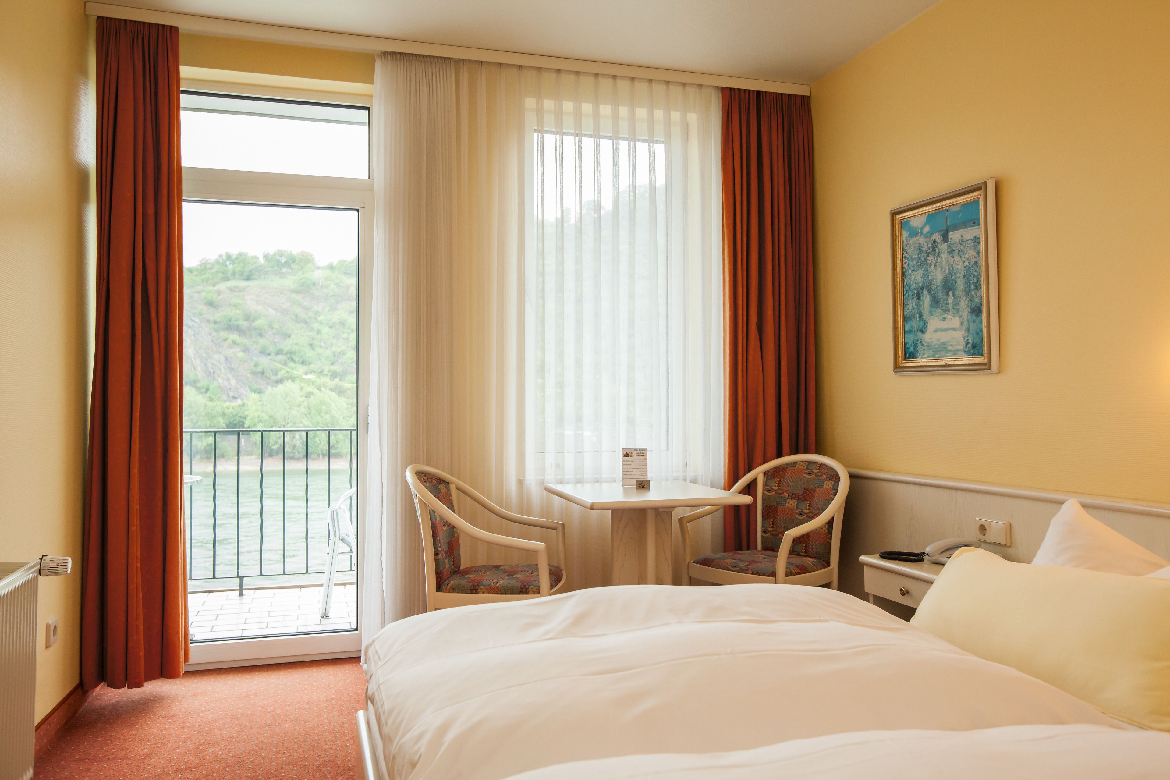 superior double room, balcony, river view | hypo-allergenic bedding, in-room safe, desk, iron/ironing board