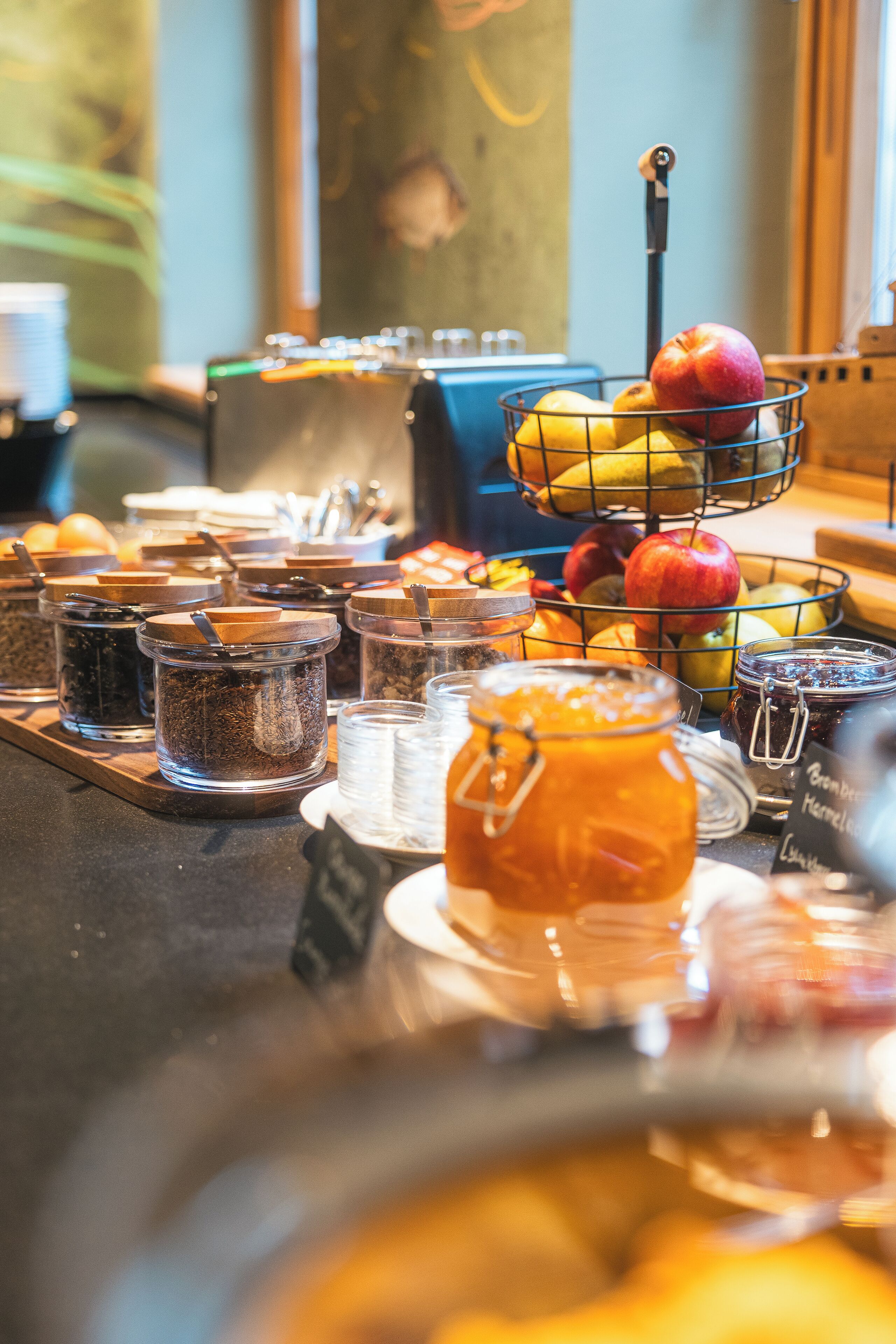 A breakfast buffet with various food items and condiments.