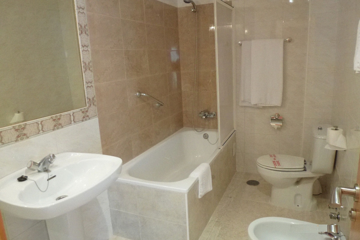 economy double room | bathroom | bathtub, free toiletries, hair dryer, bidet