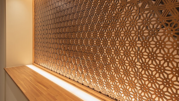 A wooden panel with intricate geometric patterns. - Shizuoka Town Hotel (Shizuoka)