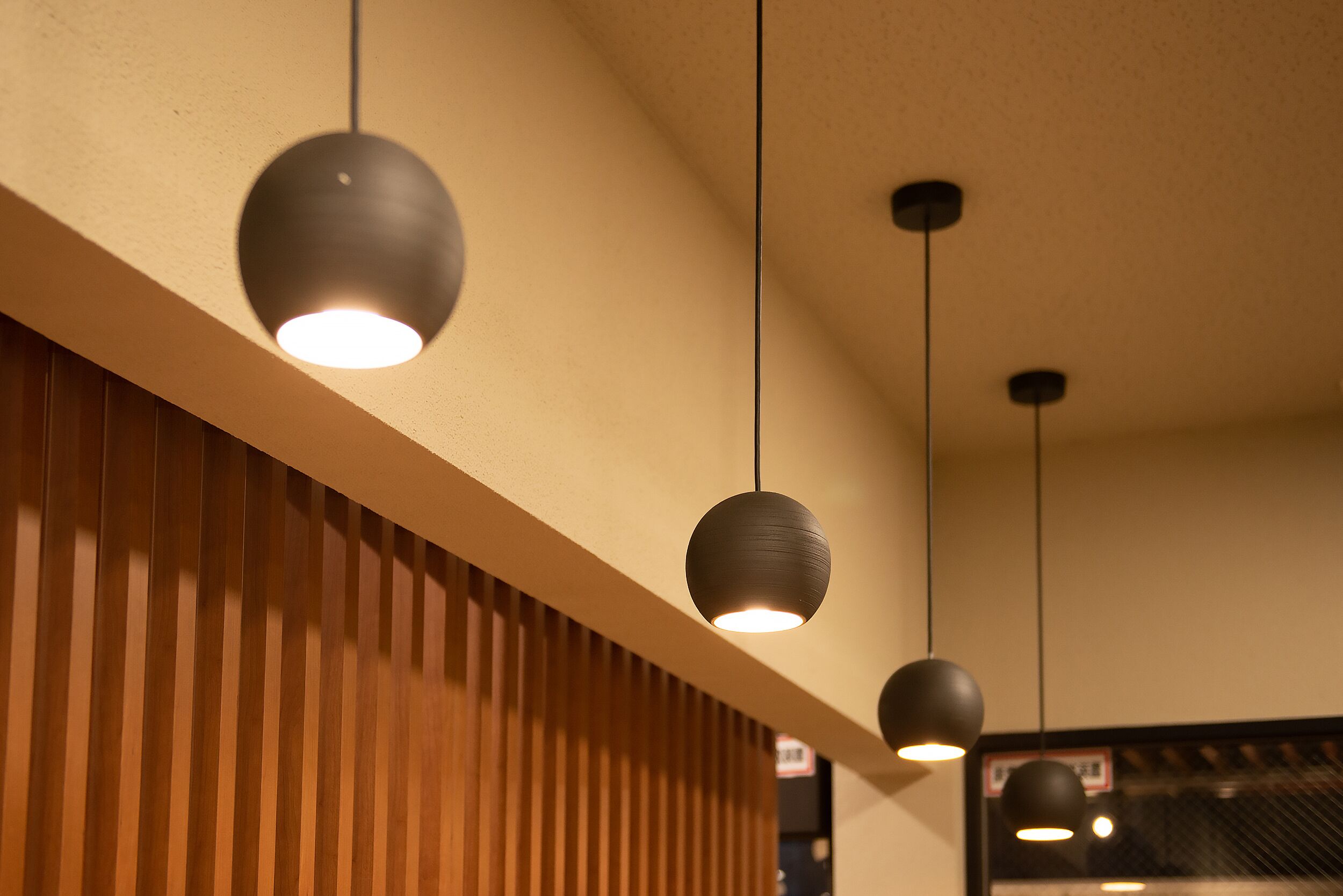 Pendant lighting fixtures in a modern interior setting.