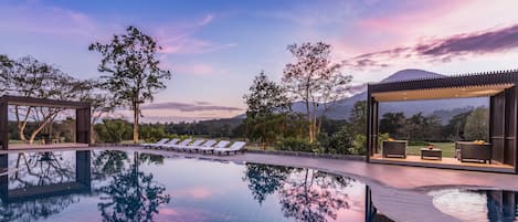 Outdoor pool, open 7:00 AM to 7:00 PM, free cabanas, pool umbrellas