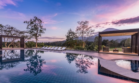 Outdoor pool, open 7:00 AM to 7:00 PM, free cabanas, pool umbrellas