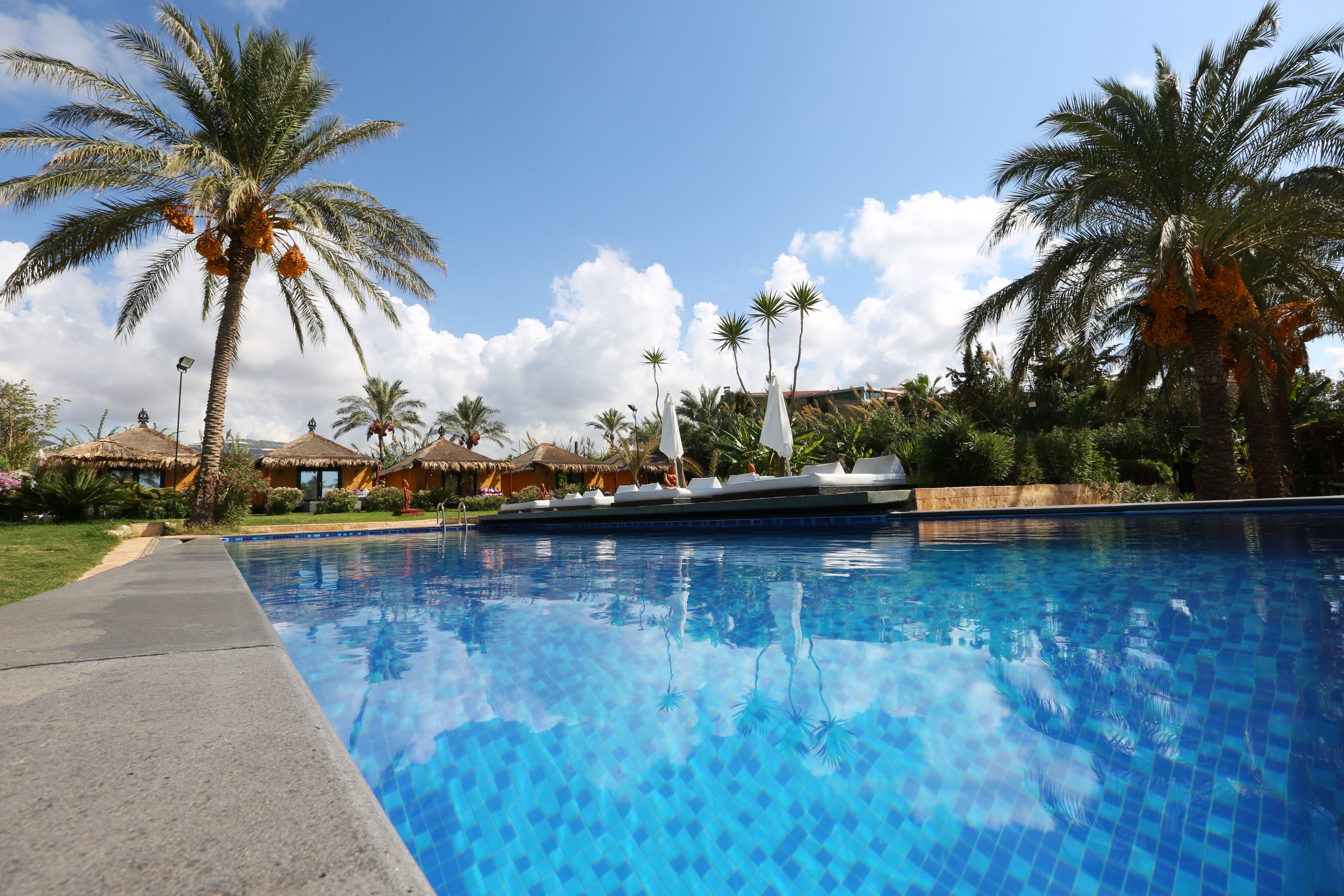 deluxe bungalow, private pool, garden view | outdoor pool | 6 outdoor pools, an infinity pool