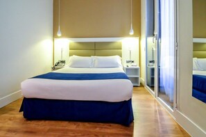 Premium bedding, down duvets, in-room safe, desk