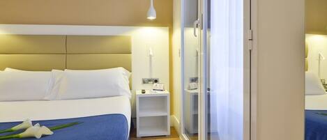 Premium bedding, down duvets, in-room safe, desk