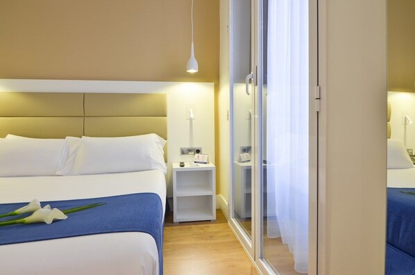 Premium bedding, down duvets, in-room safe, desk