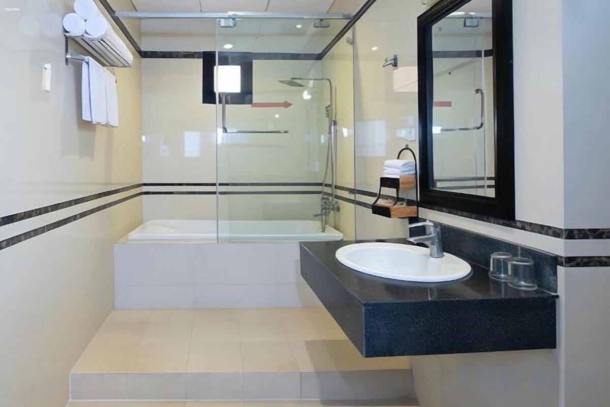 Bathroom | Shower, free toiletries, slippers, towels