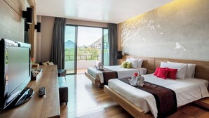 A hotel room with a large window, a flat-screen TV, two beds, a desk, and a balcony. - The Greenery Resort Khao Yai (Pak Chong)