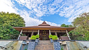 A traditional building with a tiled roof and a central entrance. - The Greenery Resort Khao Yai (Pak Chong)