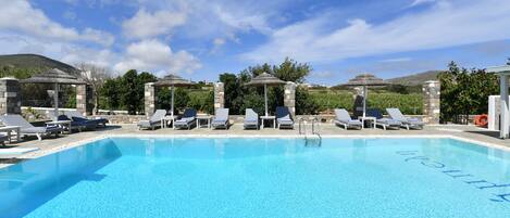 Outdoor pool, open 11:00 AM to 9:00 PM, pool umbrellas, pool loungers