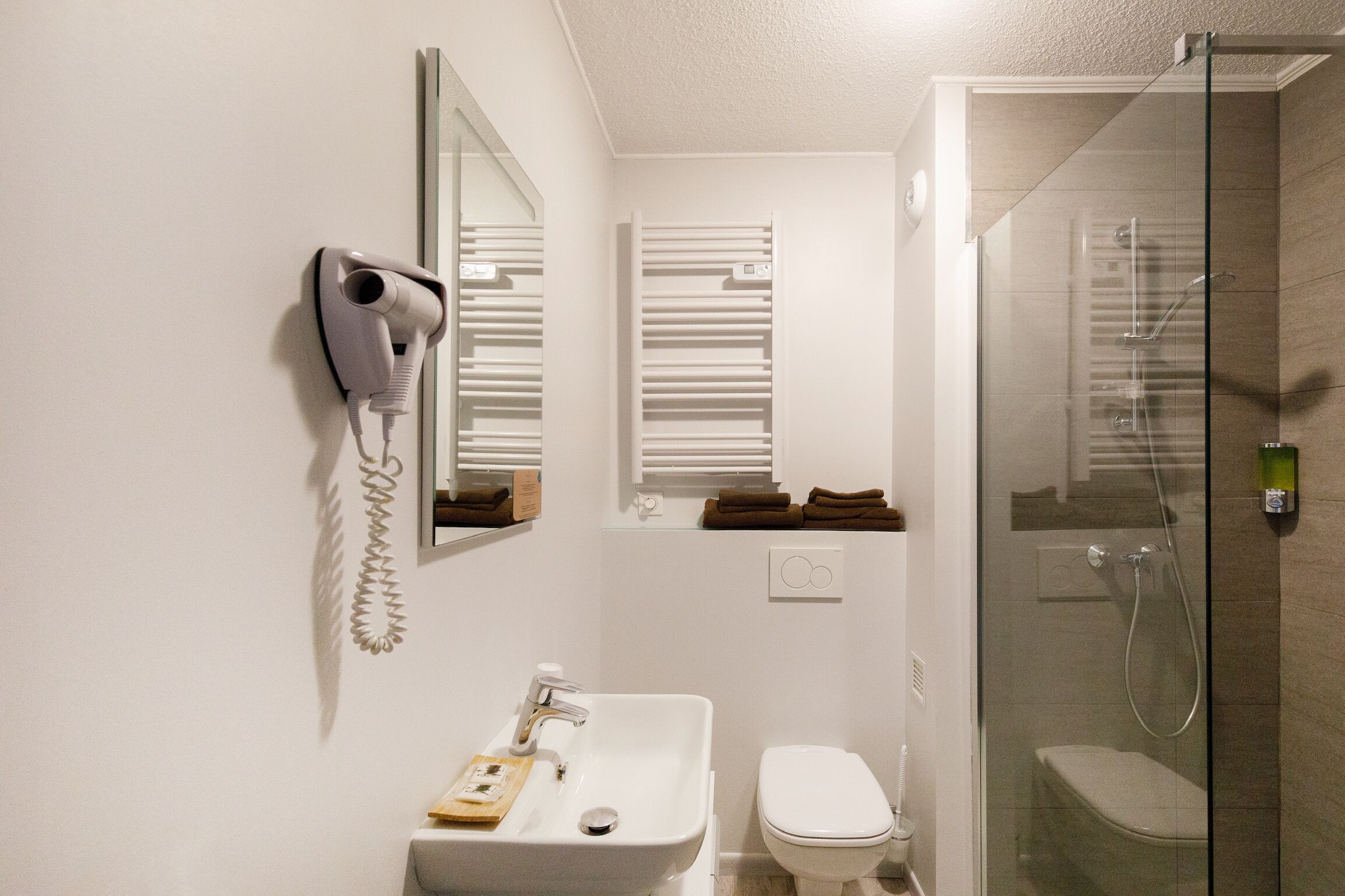 shower, eco-friendly toiletries, hair dryer, towels