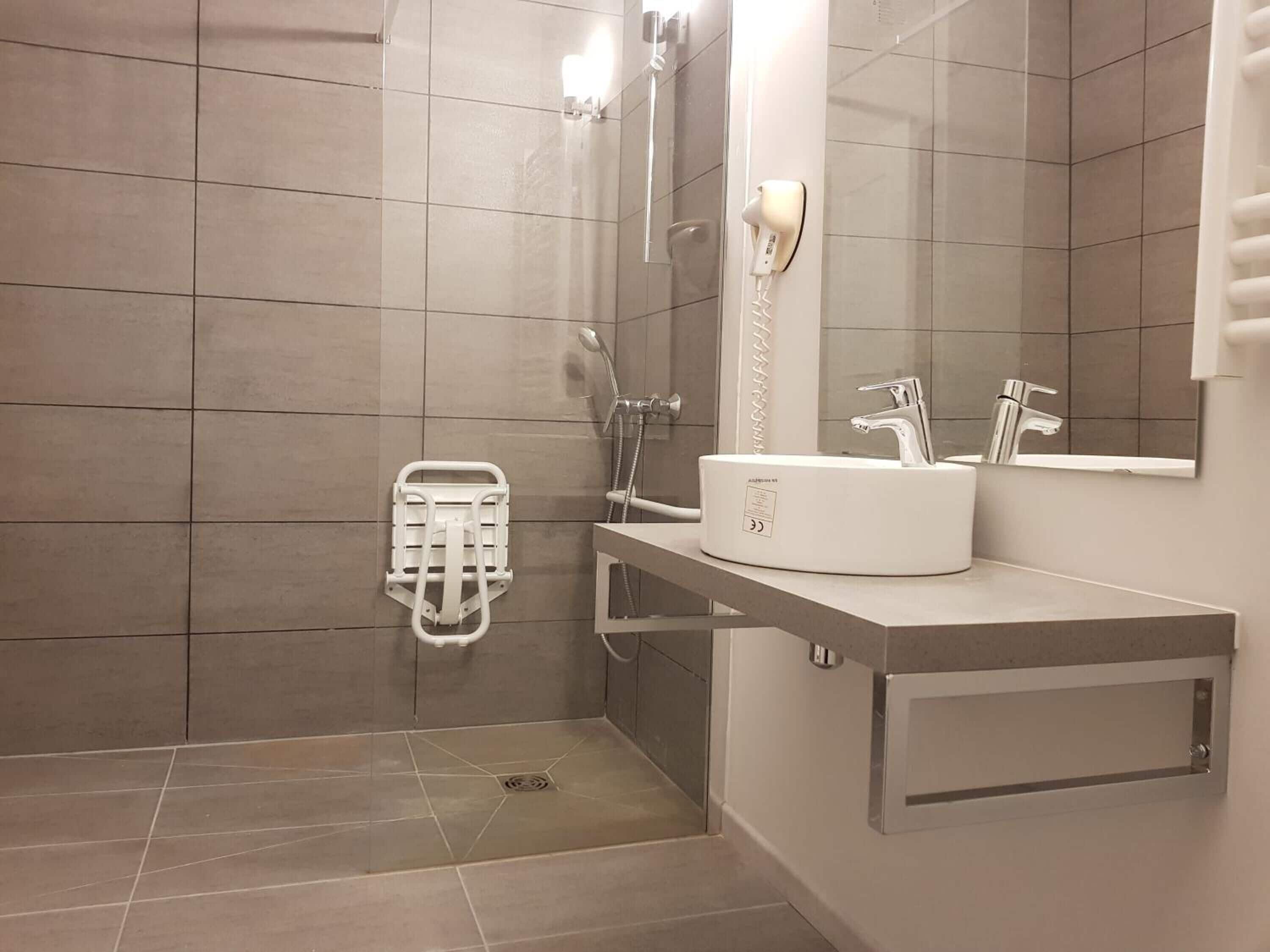 superior triple room | bathroom | shower, eco-friendly toiletries, hair dryer, towels