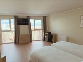 Superior Triple Room | Minibar, in-room safe, desk, laptop workspace