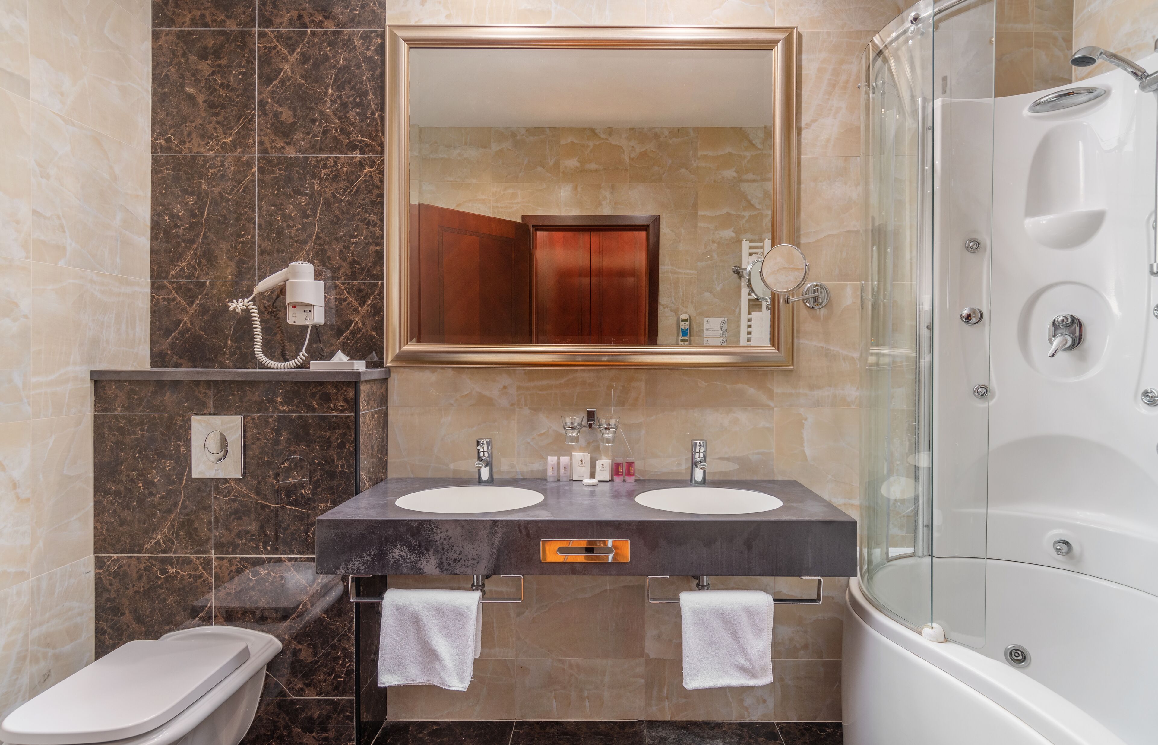 combined shower/bathtub, eco-friendly toiletries, hair dryer, bathrobes