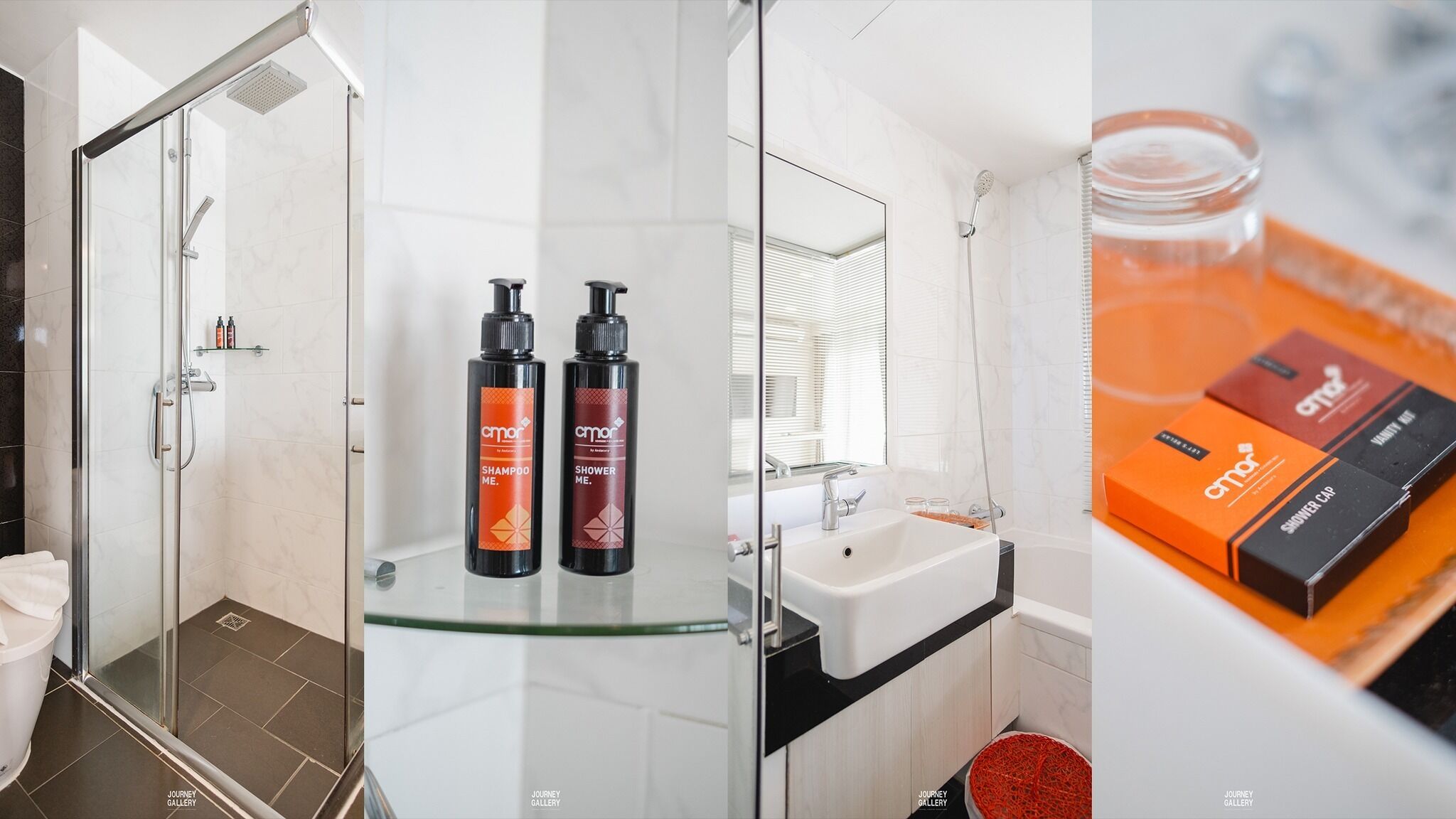 A modern bathroom with a glass shower enclosure, a glass-topped vanity, and a white sink.