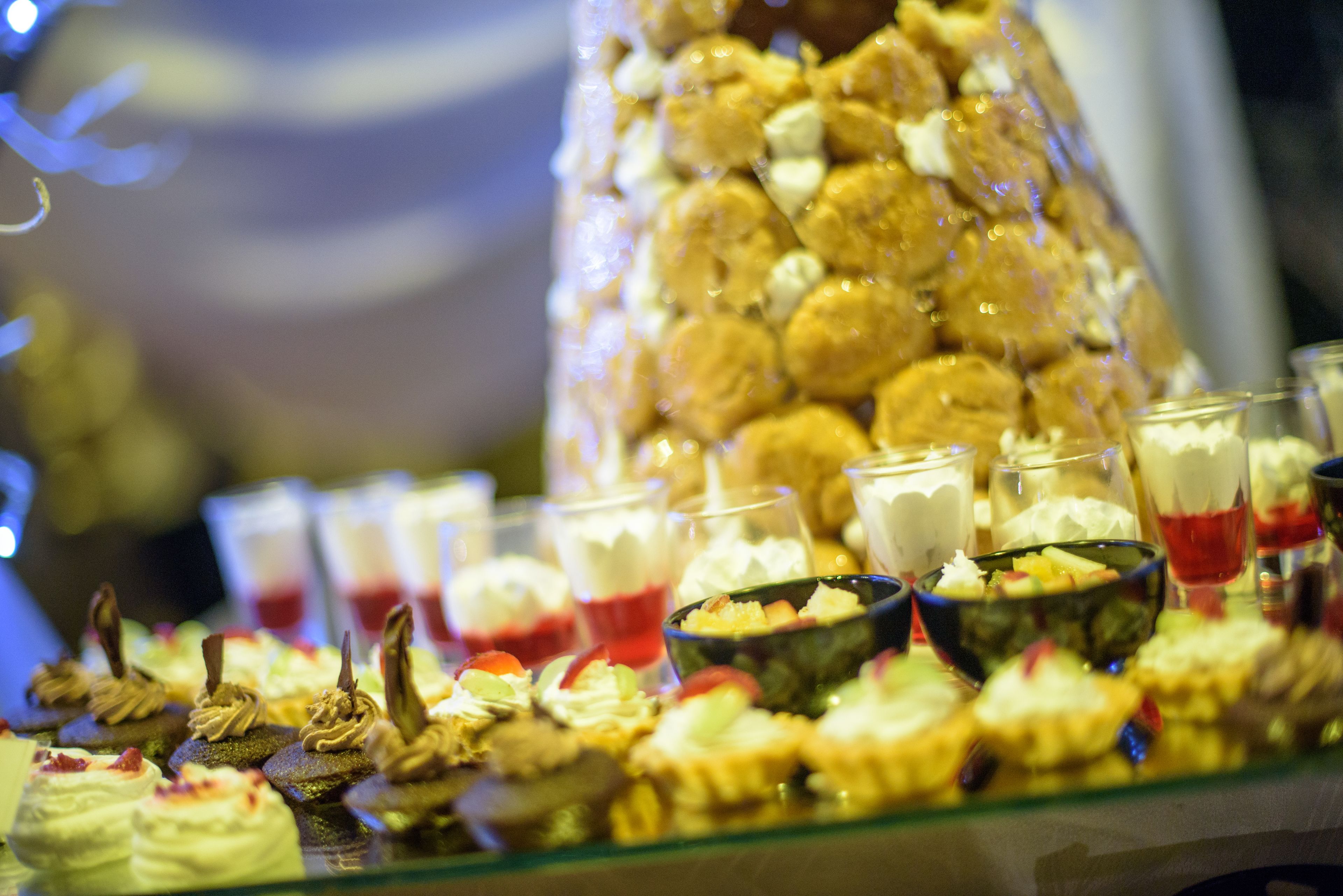 A buffet with various desserts and beverages.