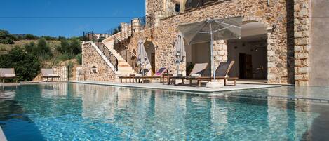 Indoor pool, outdoor pool, pool umbrellas, pool loungers