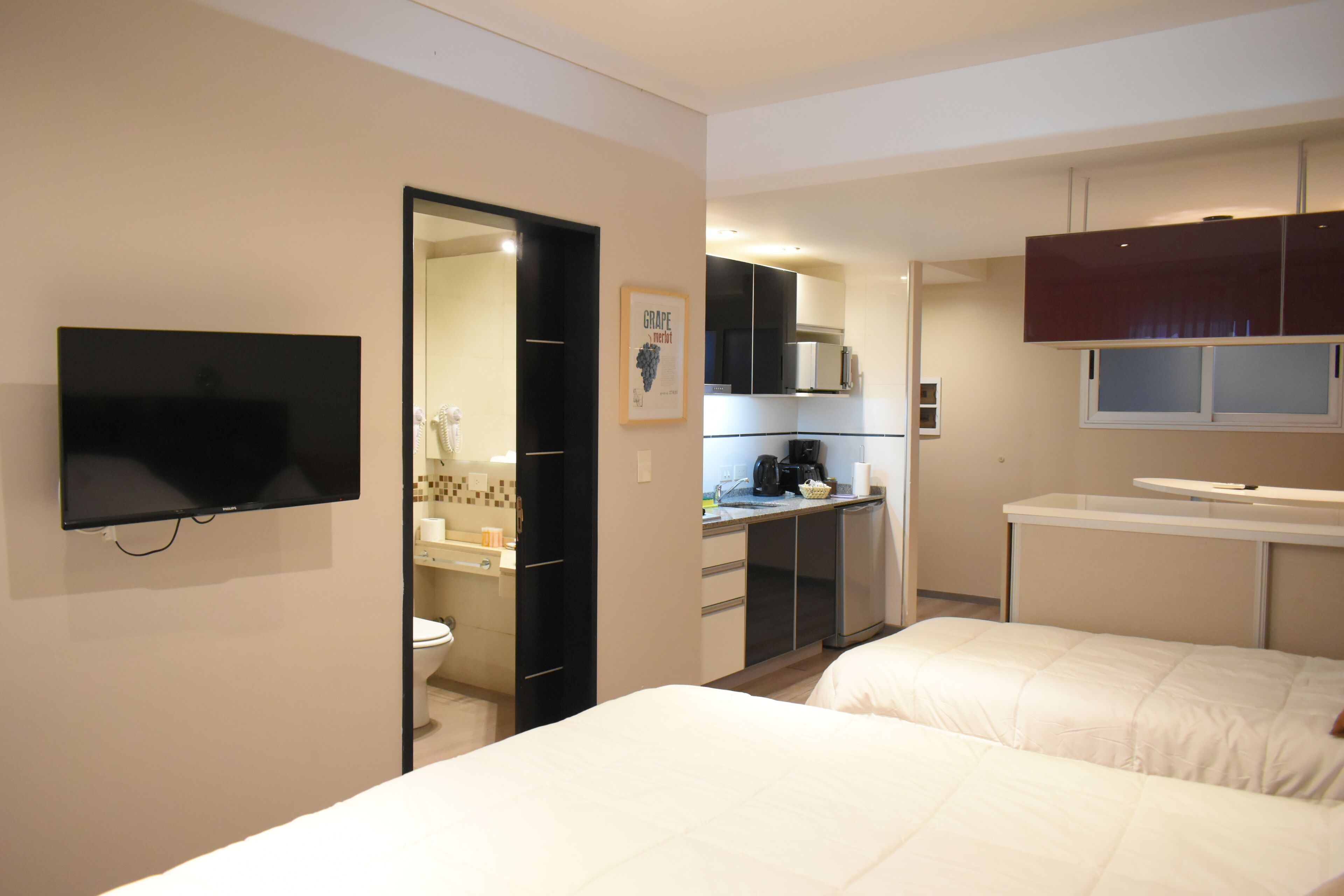Family Apartment | Living area | 30-inch LED TV with cable channels, TV, pay films