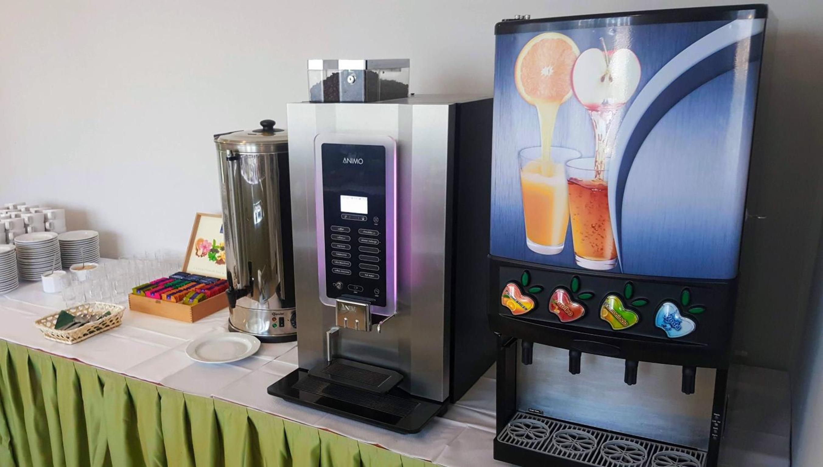 A beverage dispenser with a digital interface and a selection of drink options.